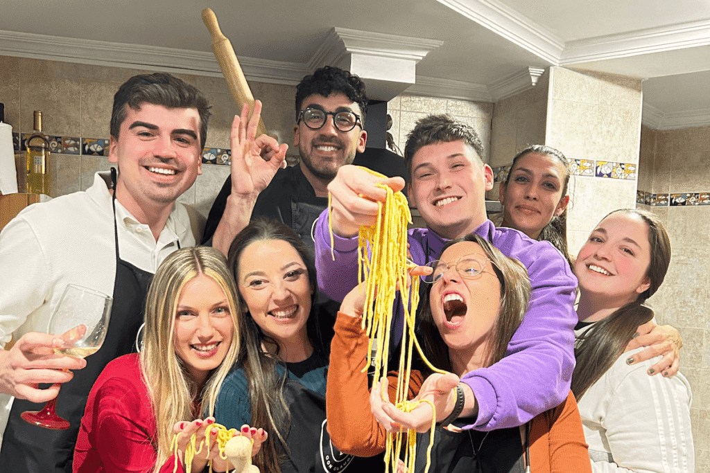 Friends cooking pasta together
